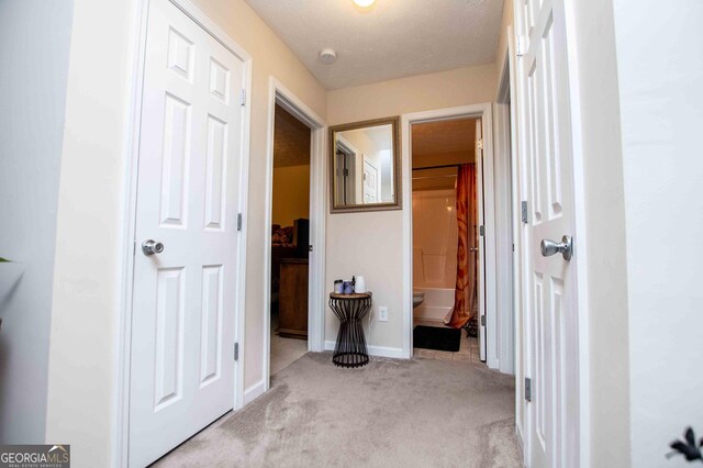 full bathroom with tile patterned floors, toilet, a textured ceiling, vanity, and shower / bath combination with curtain