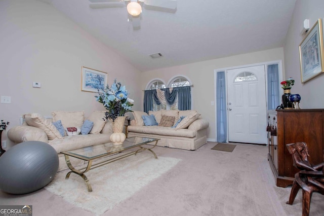 living room featuring light carpet, vaulted ceiling, and ceiling fan