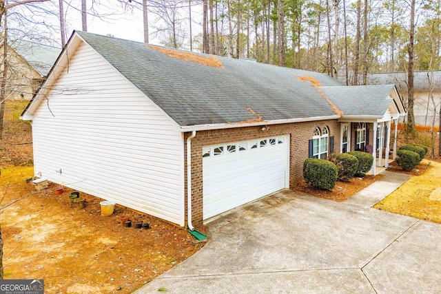 view of property exterior with a garage