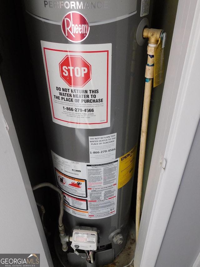 utility room with gas water heater