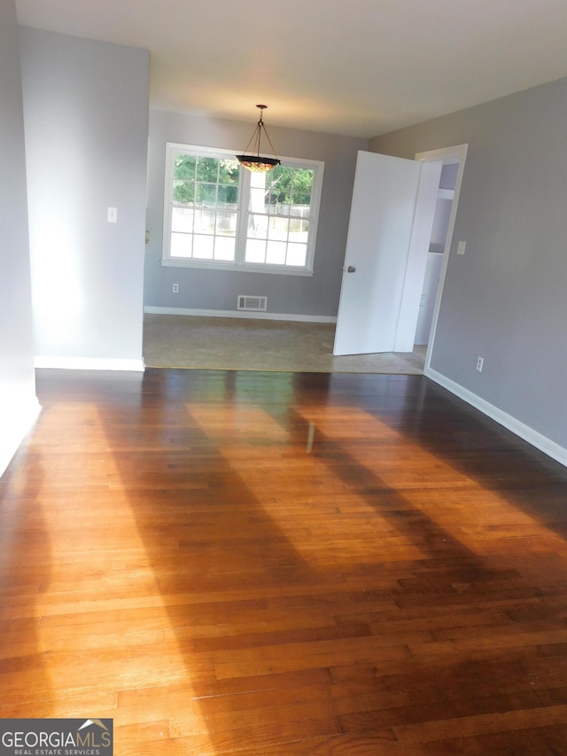 empty room featuring hardwood / wood-style flooring