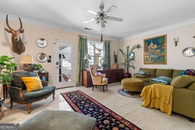 living room with ceiling fan, ornamental molding, and light tile patterned floors