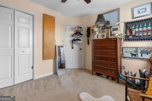 carpeted bedroom with ceiling fan