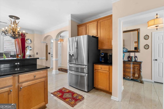 kitchen with stainless steel refrigerator with ice dispenser, ornamental molding, and light tile patterned flooring