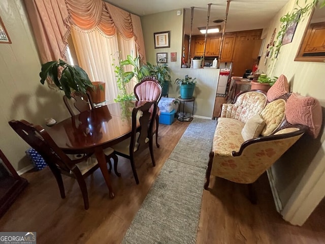 dining space with dark wood-type flooring