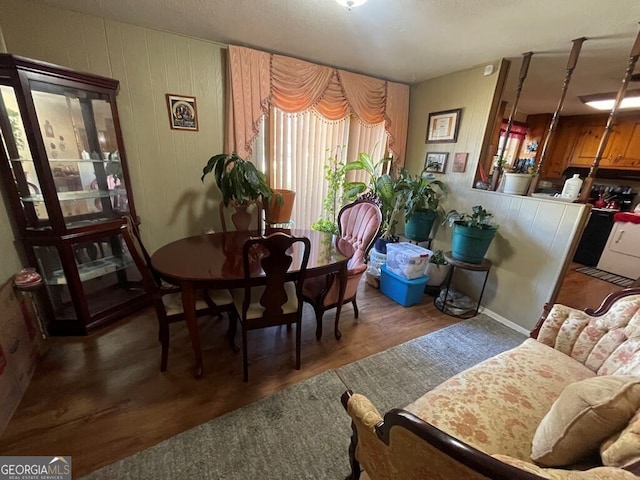 dining room with dark hardwood / wood-style flooring