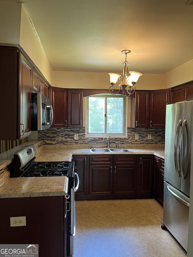 kitchen with sink, decorative light fixtures, stainless steel appliances, and backsplash