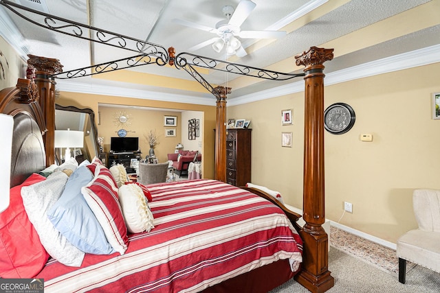 bedroom featuring crown molding, decorative columns, ceiling fan, and carpet flooring