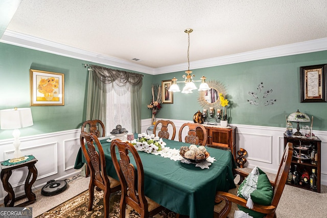 carpeted dining space featuring a notable chandelier, ornamental molding, and a textured ceiling