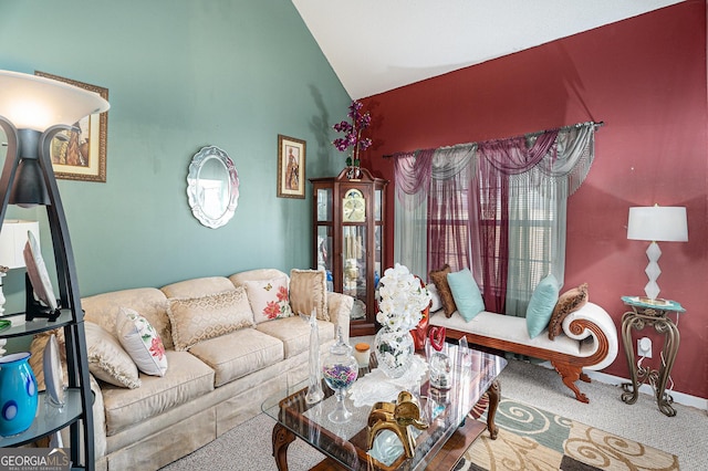 carpeted living room featuring lofted ceiling