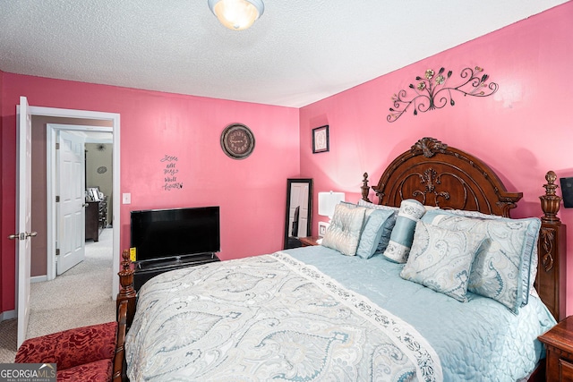 carpeted bedroom with a textured ceiling