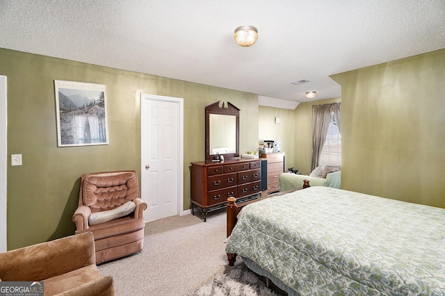 carpeted bedroom featuring a textured ceiling