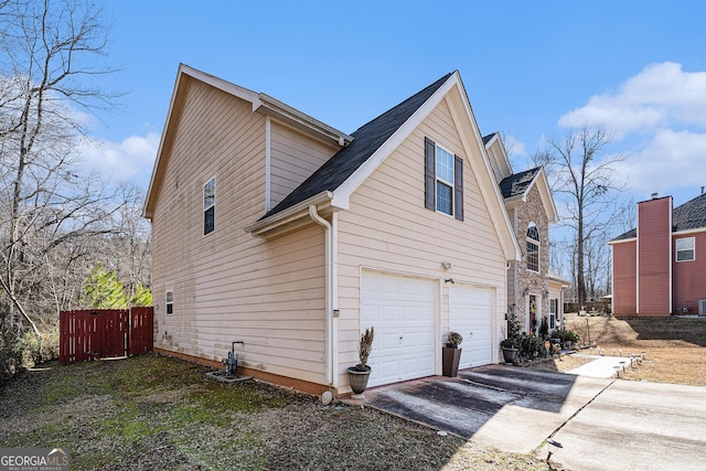 view of side of home featuring a garage