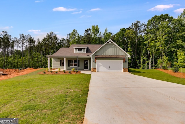 8981 Callaway Lot 87Silva, Winston, GA 30187 - craftsman-style house featuring an attached garage, board and batten siding, a front yard, concrete driveway, and covered porch