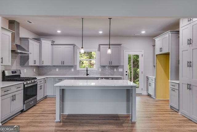 8981 Callaway Lot 87Silva, Winston, GA 30187 - kitchen with wall chimney range hood, a sink, gas stove, a healthy amount of sunlight, and gray cabinetry