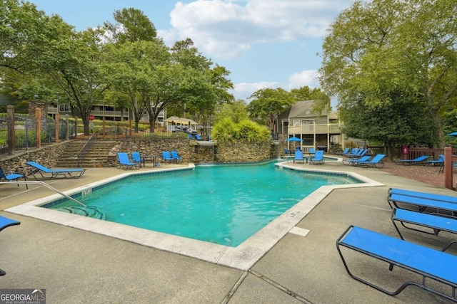 view of swimming pool with a patio area