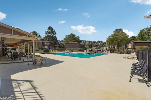 view of swimming pool with a patio