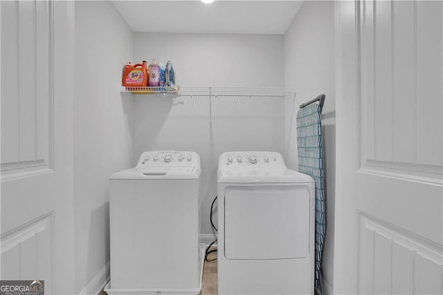 washroom featuring independent washer and dryer