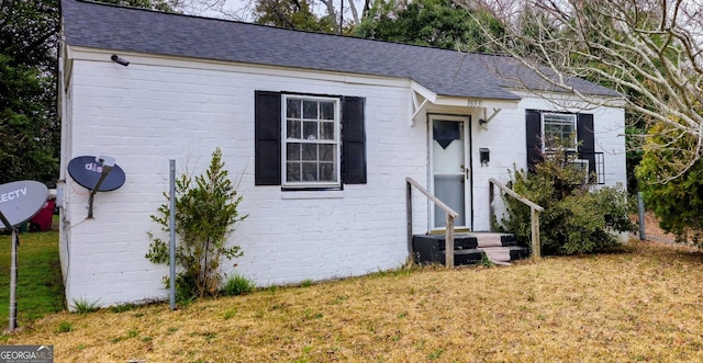 ranch-style house with a front lawn