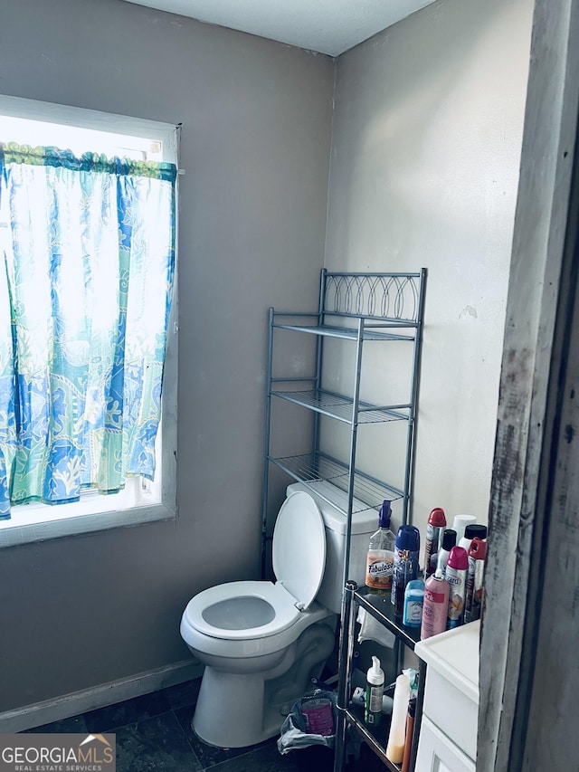 bathroom featuring tile patterned floors and toilet