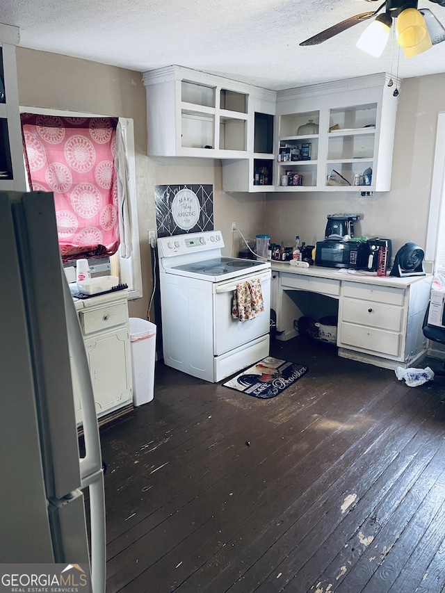 kitchen featuring dark wood-type flooring, fridge, white electric stove, ceiling fan, and white cabinets