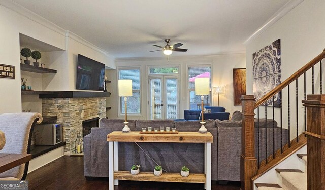 dining area featuring ornamental molding, dark hardwood / wood-style floors, a fireplace, and breakfast area