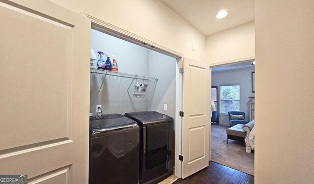 living room with built in shelves, dark wood-type flooring, ornamental molding, ceiling fan, and a fireplace