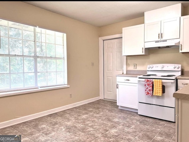 kitchen featuring white electric stove and white cabinets