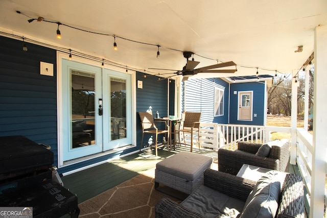 view of patio / terrace with an outdoor living space, ceiling fan, and french doors