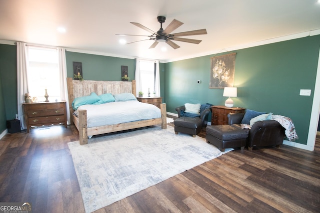 bedroom with ceiling fan, ornamental molding, dark hardwood / wood-style flooring, and multiple windows