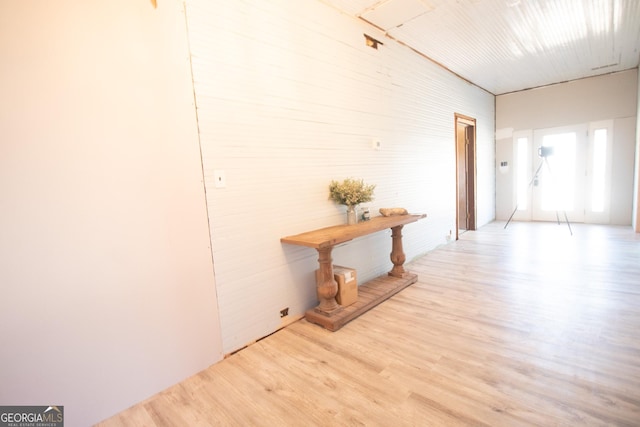 corridor with light hardwood / wood-style floors