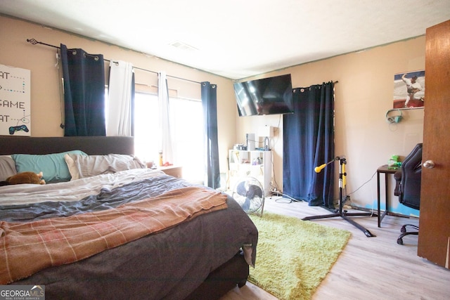 bedroom with light wood-type flooring