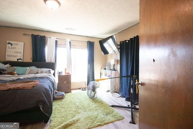 bedroom with light hardwood / wood-style floors