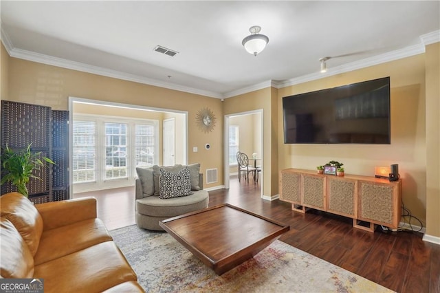 living room with ornamental molding and dark hardwood / wood-style flooring