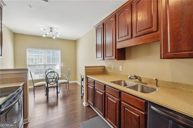 kitchen featuring dark wood-type flooring, stainless steel dishwasher, sink, and range with electric stovetop