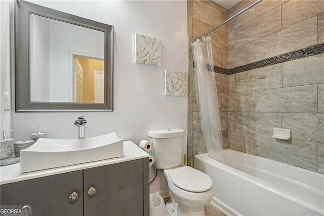 full bathroom featuring vanity, toilet, and shower / bathtub combination with curtain