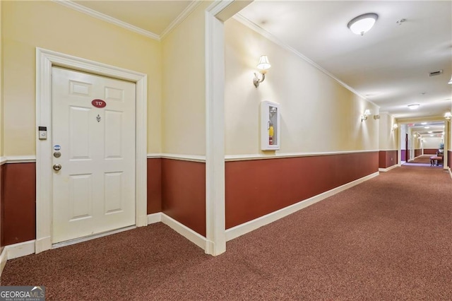 entrance foyer featuring crown molding and carpet floors