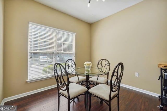 dining area featuring dark hardwood / wood-style flooring