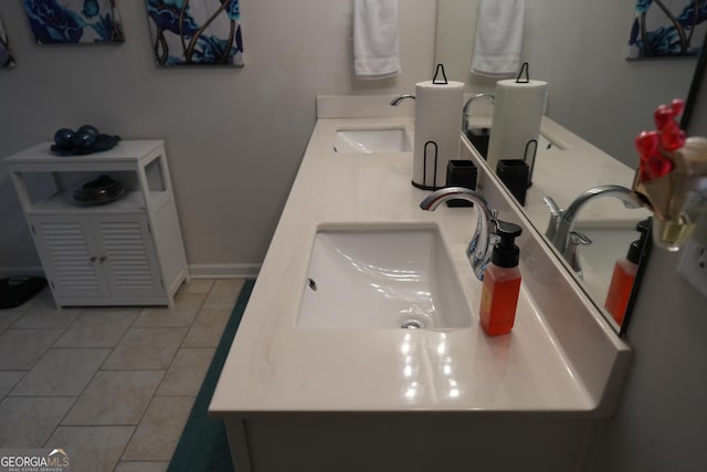 bathroom with tile patterned flooring and vanity