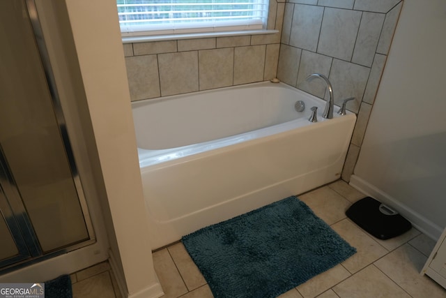 bathroom featuring independent shower and bath and tile patterned flooring