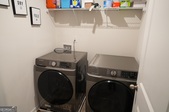 laundry area featuring washing machine and clothes dryer