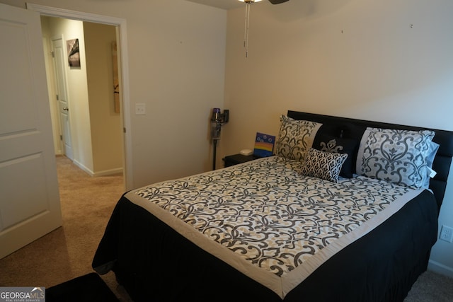 bedroom with ceiling fan and light colored carpet