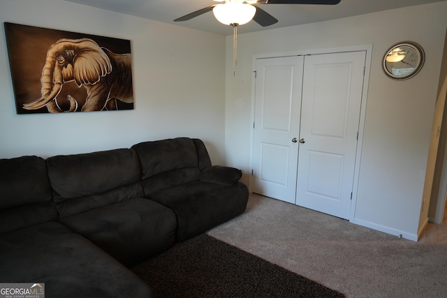 carpeted living room featuring ceiling fan