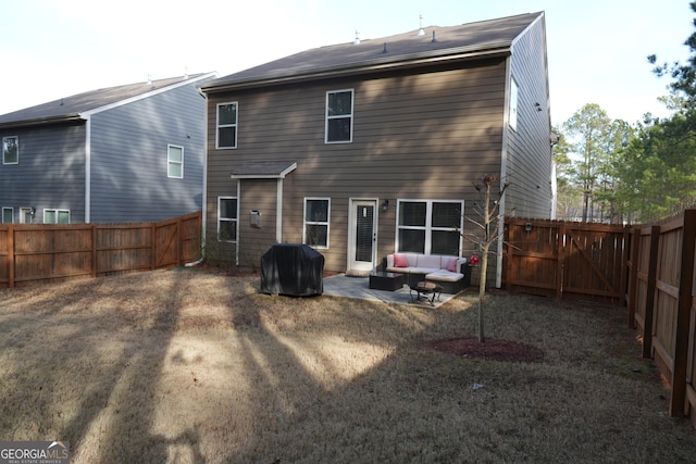 back of property with an outdoor hangout area and a patio