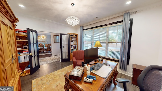 office space with an inviting chandelier, dark hardwood / wood-style flooring, and crown molding