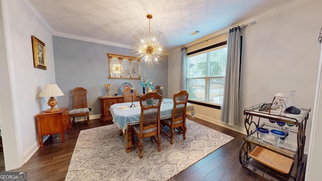 dining room with crown molding, dark wood-type flooring, a notable chandelier, and a textured ceiling