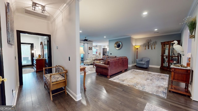 living room featuring ornamental molding, dark hardwood / wood-style floors, and ceiling fan