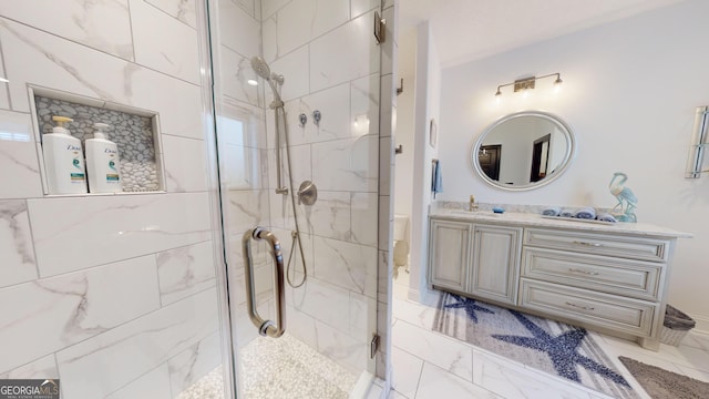 bathroom with vanity and an enclosed shower