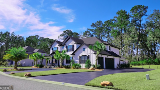 view of front of house featuring a garage and a front yard