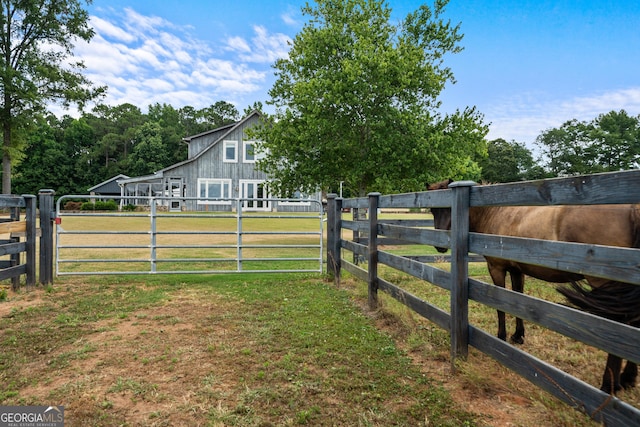 view of yard with a rural view